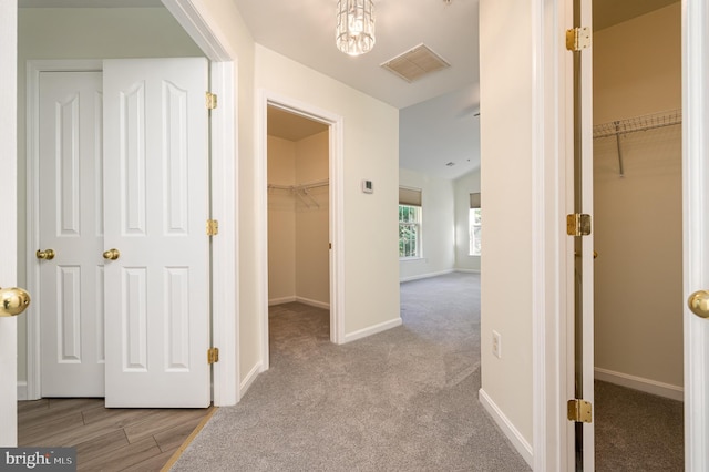 hallway with light carpet