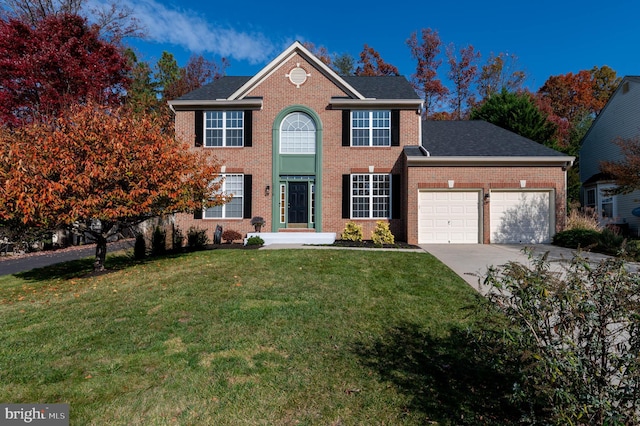 view of front of house with a front lawn and a garage