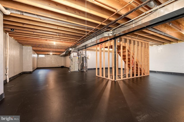 basement with heating unit and water heater