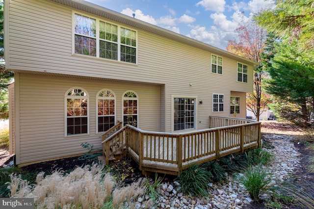 rear view of property with a deck