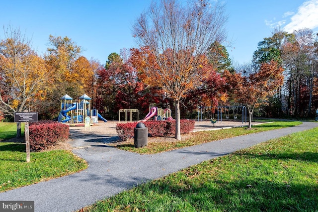 view of jungle gym featuring a lawn