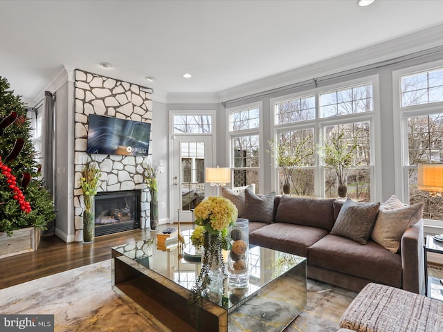 sunroom / solarium with plenty of natural light and a fireplace