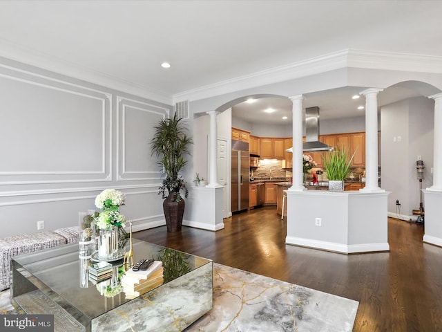 dining space with dark hardwood / wood-style flooring and crown molding