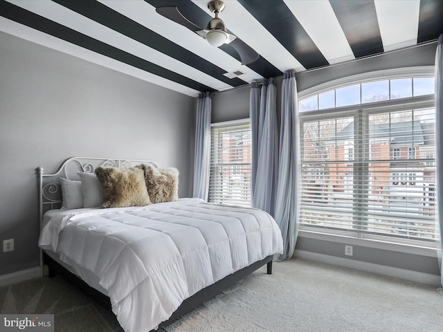 bedroom featuring carpet, multiple windows, and ceiling fan