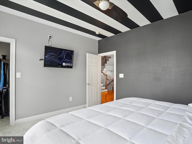 carpeted bedroom featuring a spacious closet