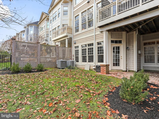 rear view of property with central air condition unit