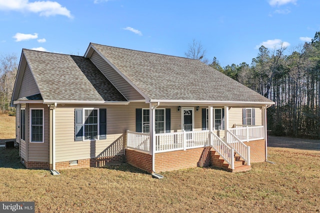 view of front facade featuring a front lawn and covered porch