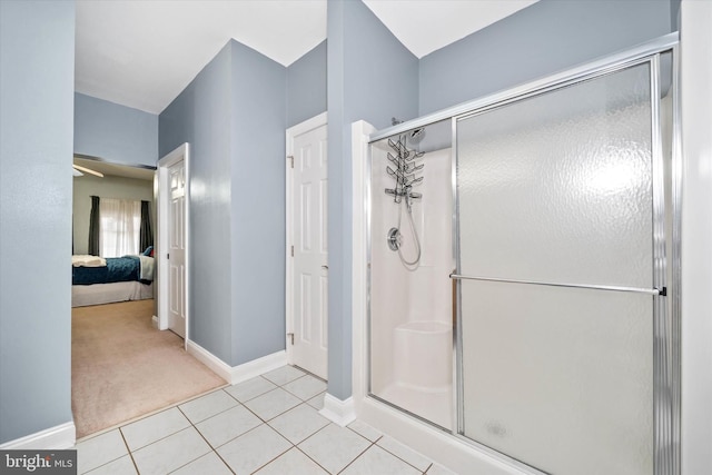 bathroom with tile patterned flooring and walk in shower