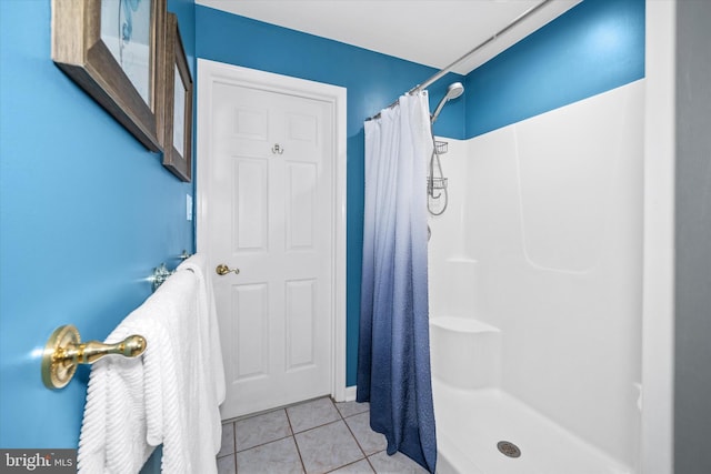 bathroom featuring tile patterned floors and walk in shower