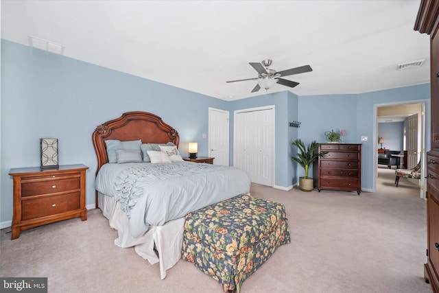 carpeted bedroom featuring a closet and ceiling fan