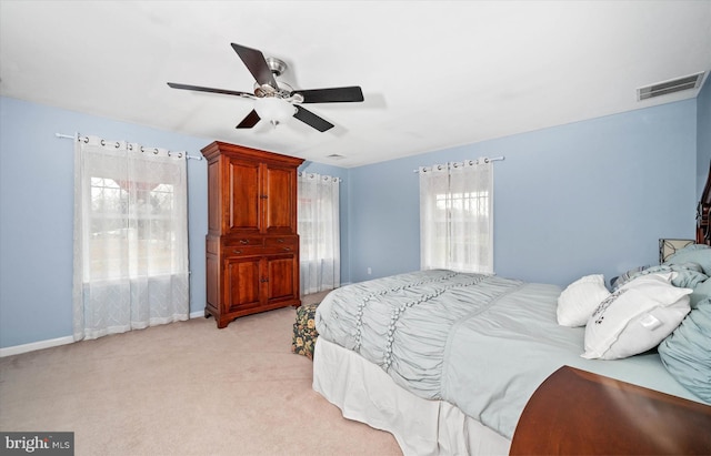 bedroom with ceiling fan and light colored carpet