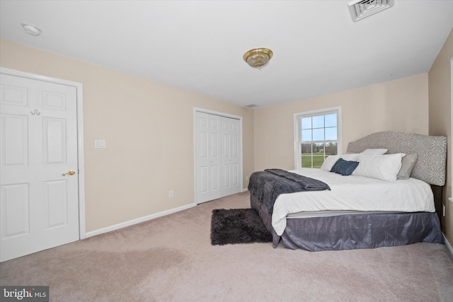 carpeted bedroom featuring a closet