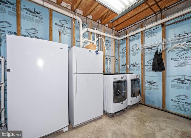 clothes washing area with washing machine and clothes dryer