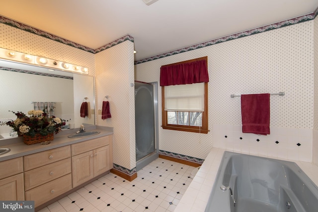 bathroom with vanity and plus walk in shower