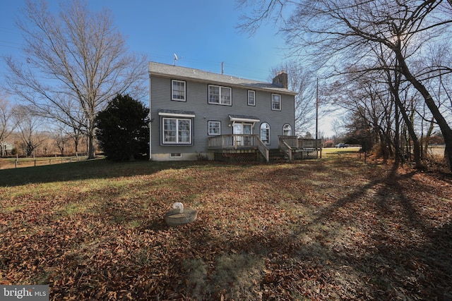 back of house with a wooden deck