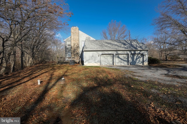 view of side of property featuring a garage