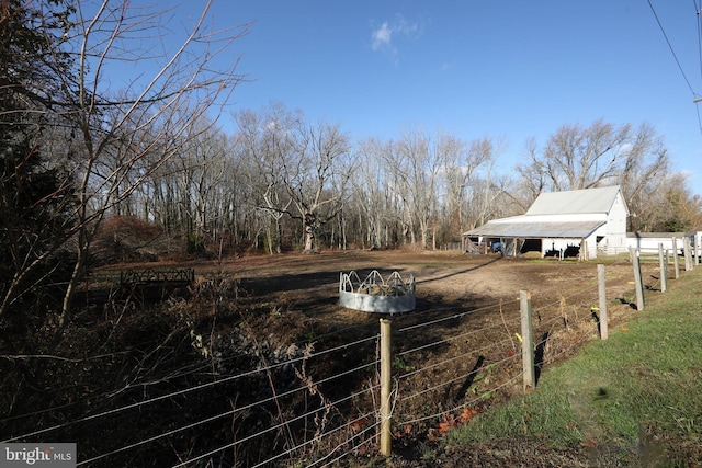 view of yard with a rural view