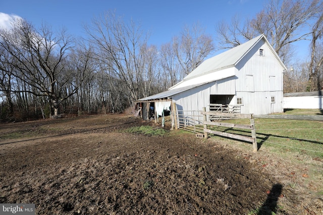 view of side of property featuring an outdoor structure