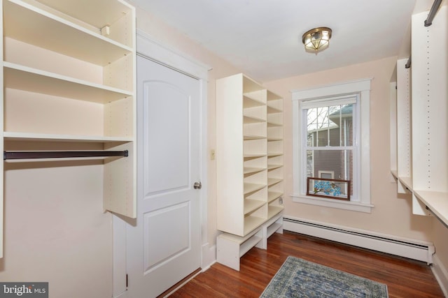 closet with a baseboard heating unit