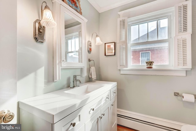 bathroom featuring vanity, a baseboard radiator, and ornamental molding