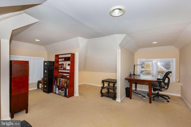 carpeted office space with lofted ceiling