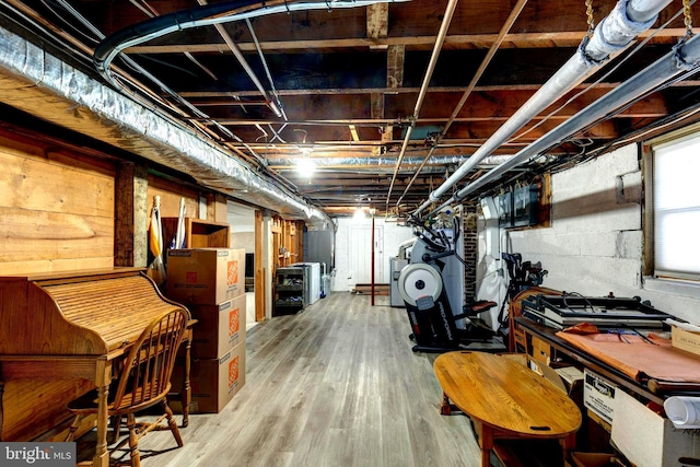 basement with hardwood / wood-style flooring