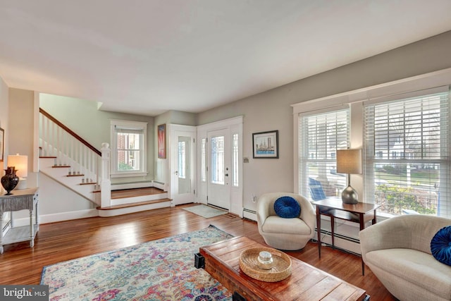 entryway featuring hardwood / wood-style floors and a baseboard radiator