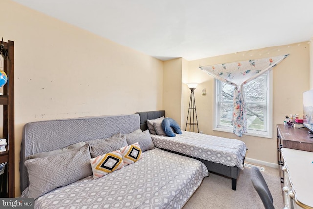 bedroom with light colored carpet