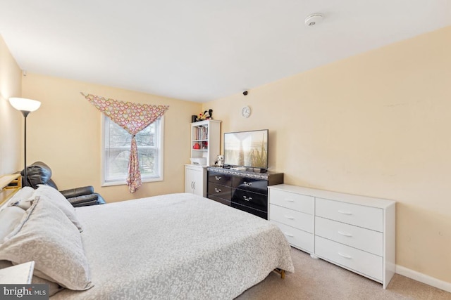 bedroom with light carpet