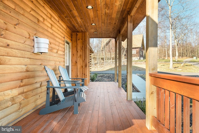 wooden terrace with a porch