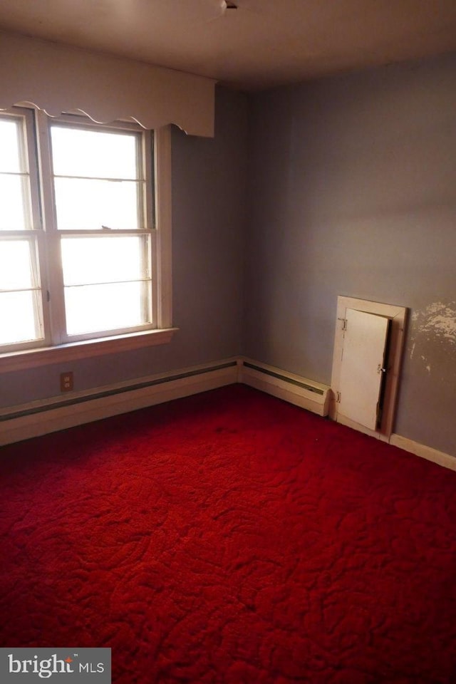 carpeted empty room featuring a wealth of natural light