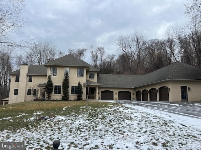 view of front of home featuring a yard and a garage