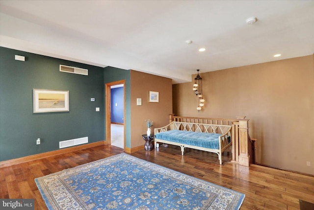 bedroom with hardwood / wood-style flooring