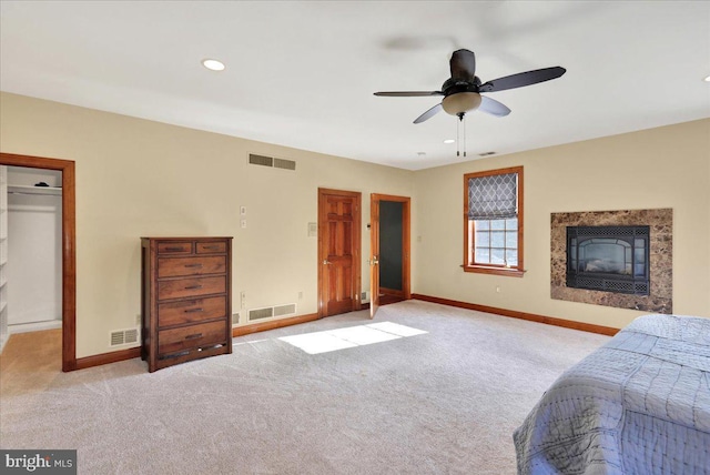 bedroom featuring ceiling fan and light colored carpet