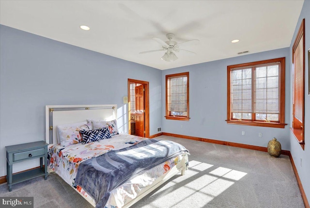 bedroom with ceiling fan and carpet floors