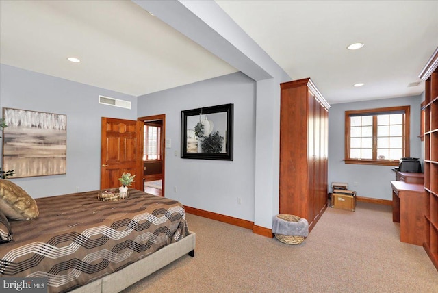 bedroom with light colored carpet