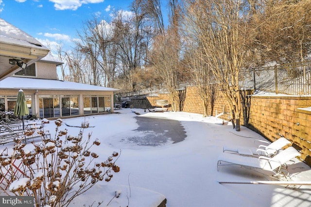 view of yard layered in snow