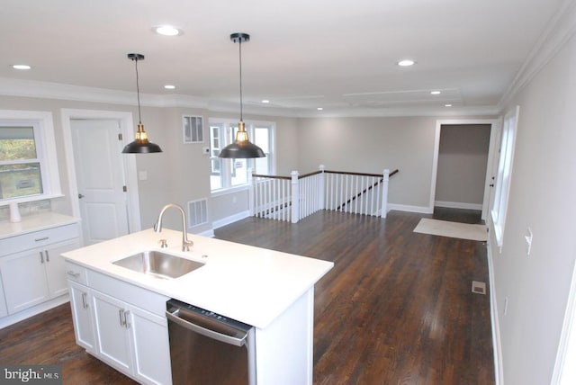 kitchen with stainless steel dishwasher, plenty of natural light, white cabinetry, and decorative light fixtures