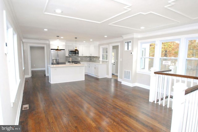 unfurnished living room with crown molding and dark wood-type flooring