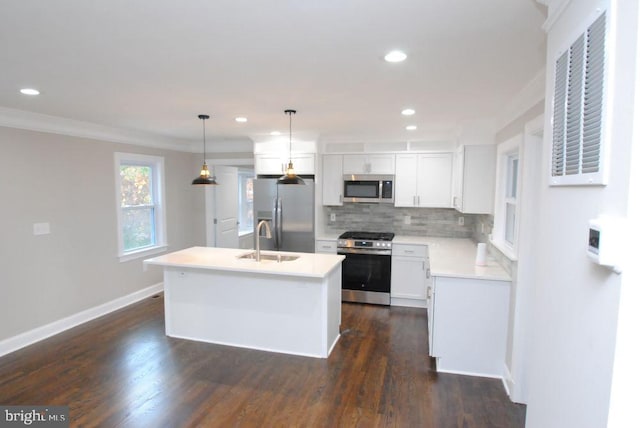 kitchen featuring pendant lighting, a kitchen island, dark hardwood / wood-style flooring, and stainless steel appliances