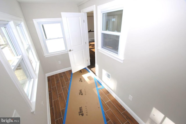 hall with dark hardwood / wood-style floors