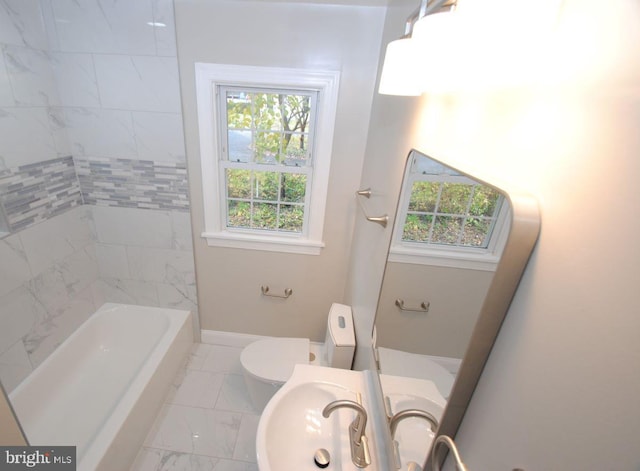 bathroom featuring sink and toilet