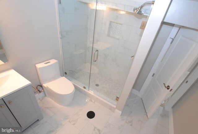 bathroom with vanity, toilet, and walk in shower