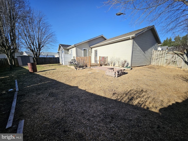 rear view of house with a shed