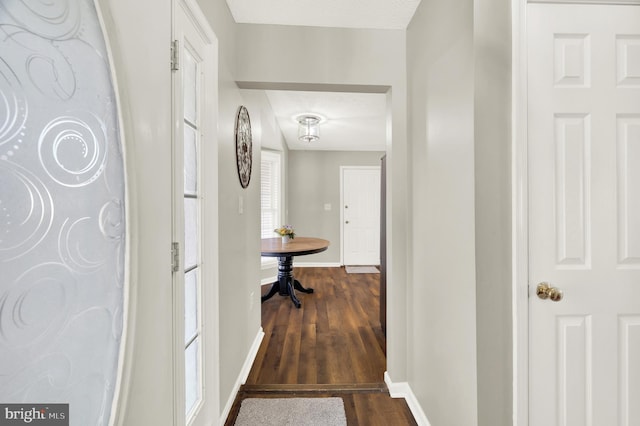 corridor featuring dark hardwood / wood-style flooring