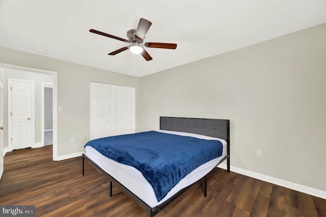 bedroom with ceiling fan, dark hardwood / wood-style flooring, and a closet