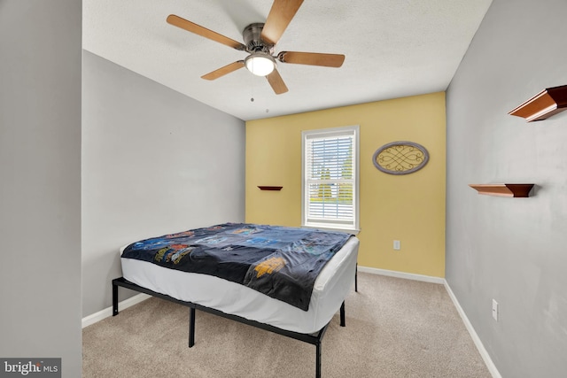 bedroom featuring ceiling fan and light colored carpet