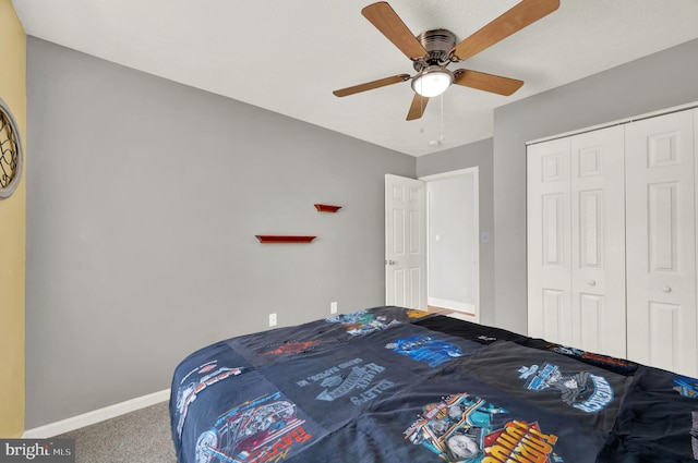 bedroom with carpet, a closet, and ceiling fan