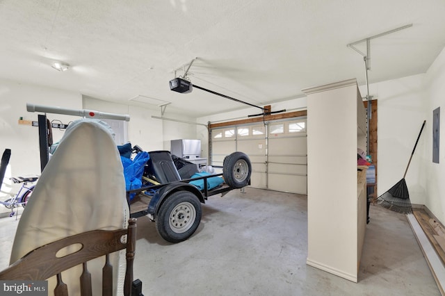 garage featuring electric panel and a garage door opener