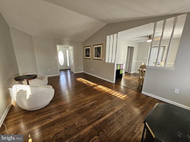 foyer with dark hardwood / wood-style floors, ceiling fan, lofted ceiling, and a wealth of natural light